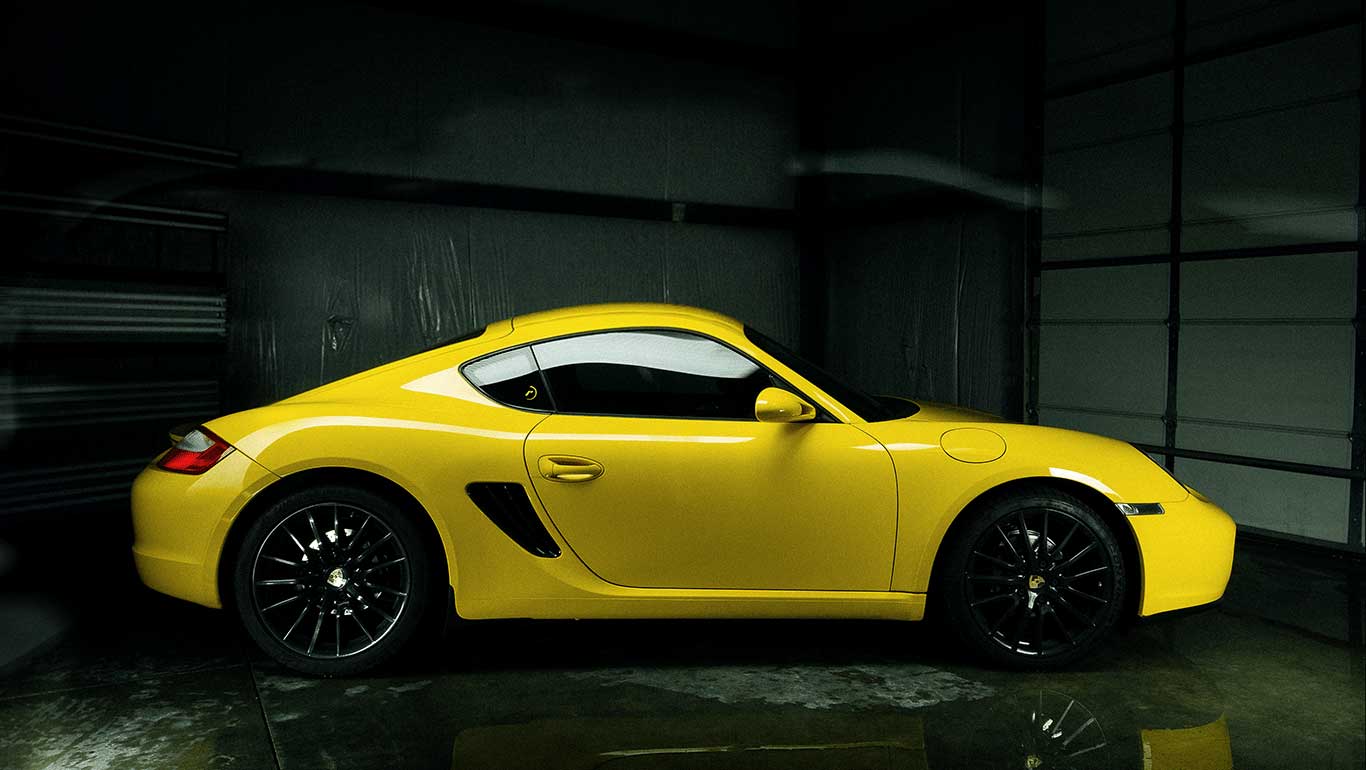 A bright, brilliantly lustrous and pristine yellow sports car