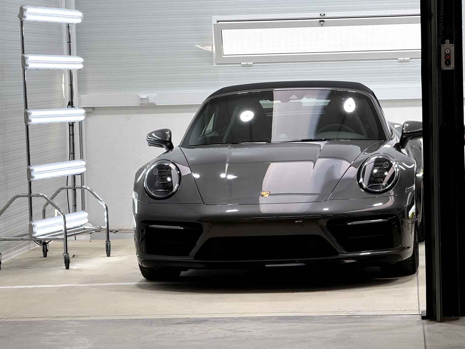 RestorFX center shop area with a gray Porsche and LED lights shining on it