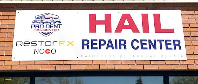 RestorFX NOCO outdoor sign mounted on a brick facade wall