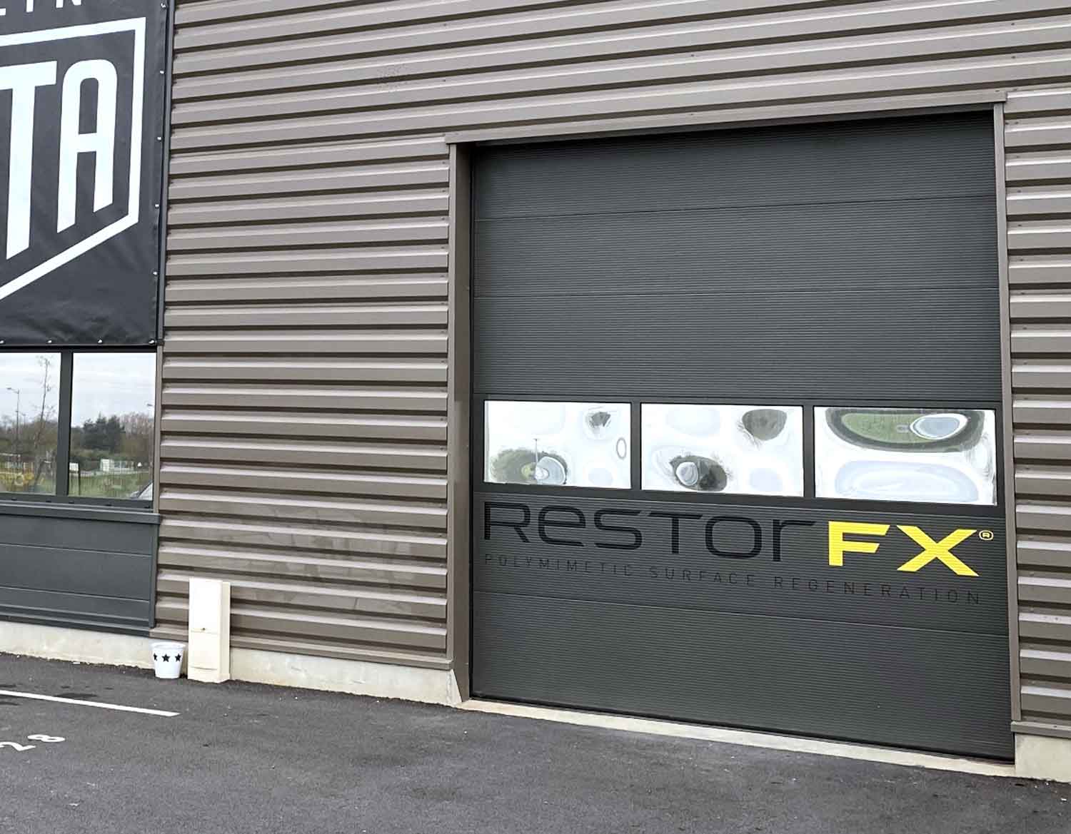 RestorFX Chessy center garage door with branded decals