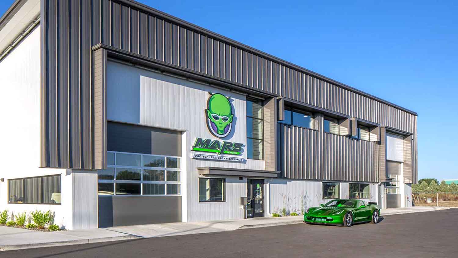 MARS of Billings center building exterior at an angle with green sports car parked