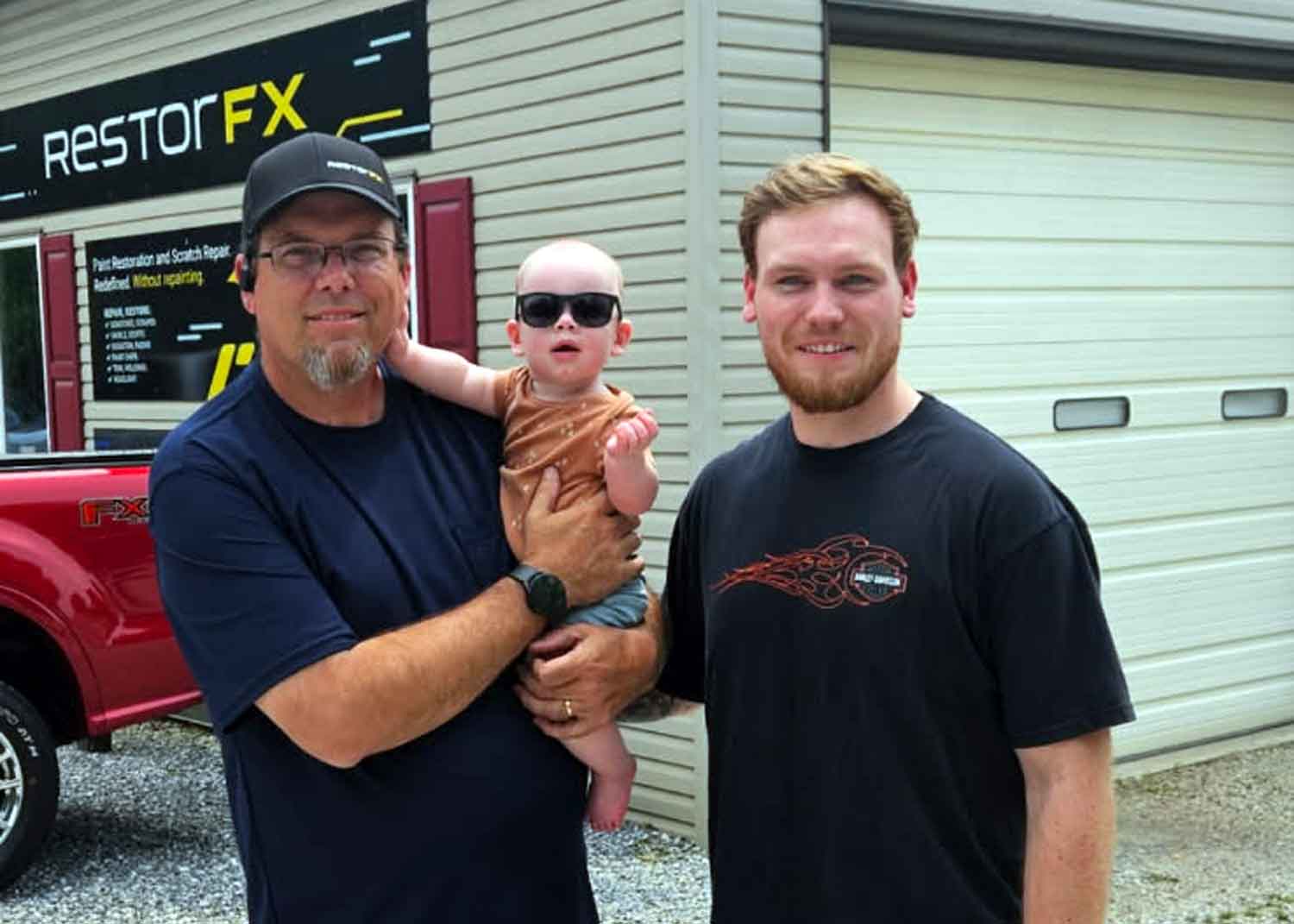 Owner and operator as a family standing in front of the RestorFX York center