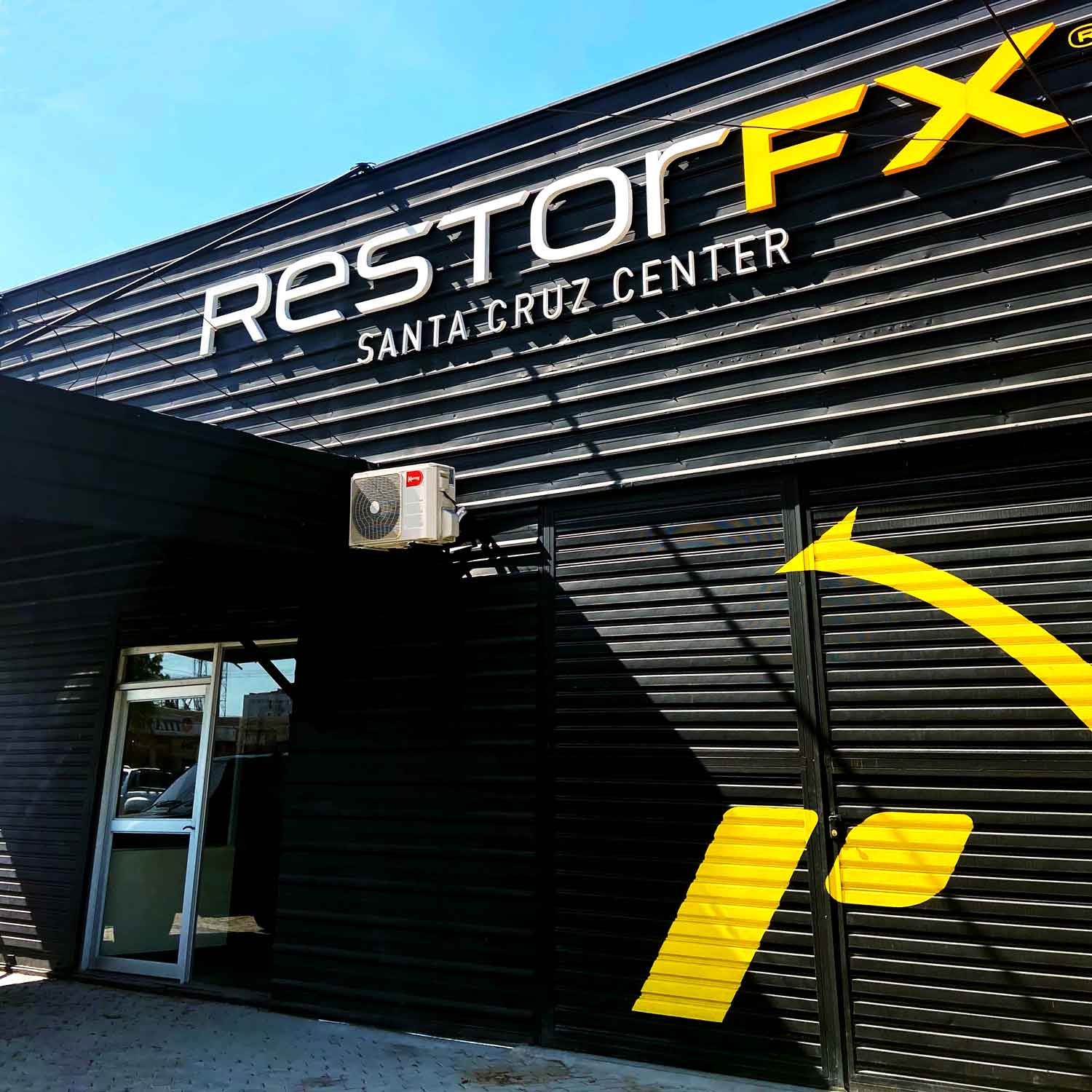 RestorFX Santa Cruz center exterior with branded storefront and blue sky