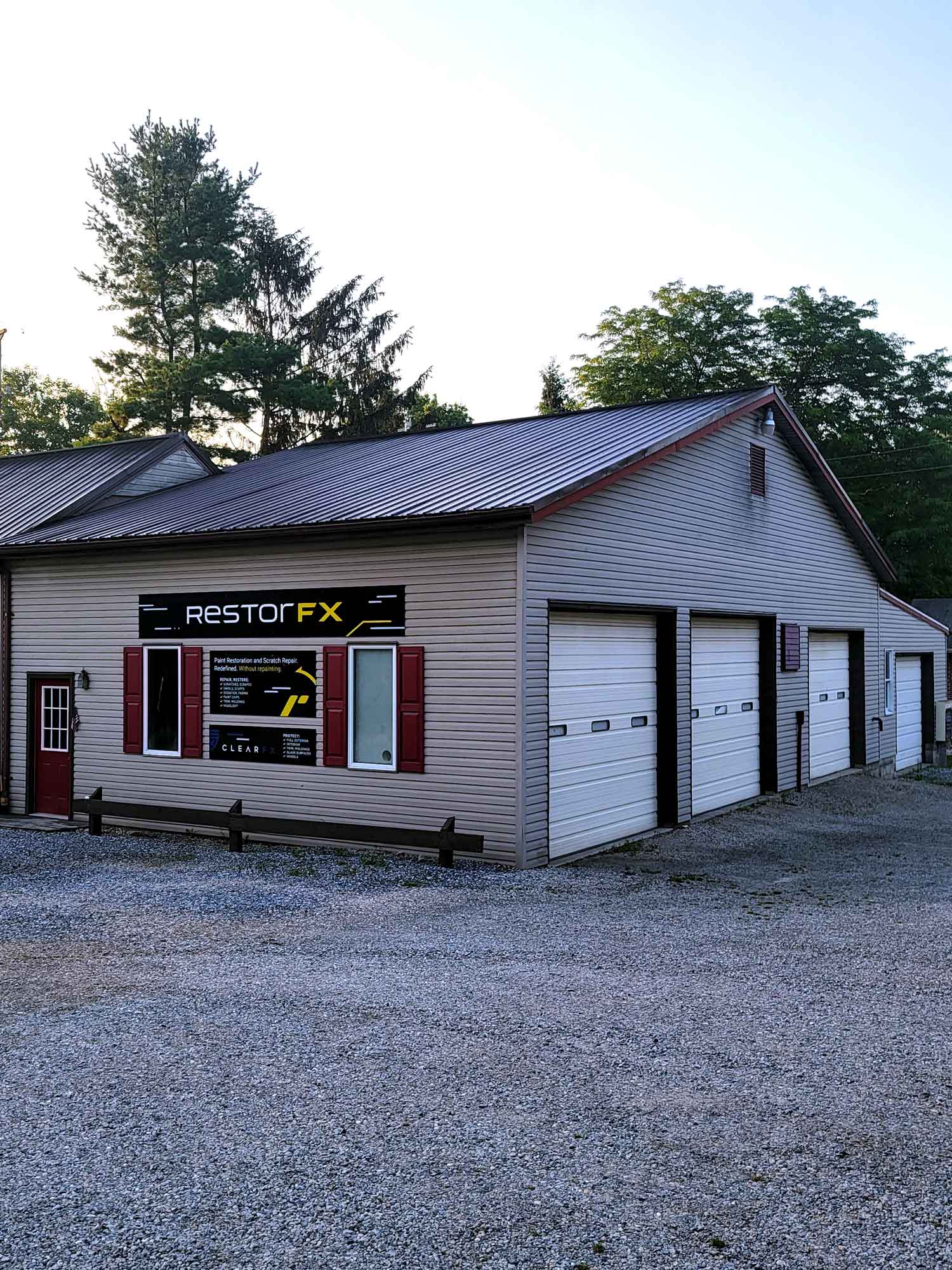 RestorFX York center outside area with branded sign mounted above the windows with garage doors on the side