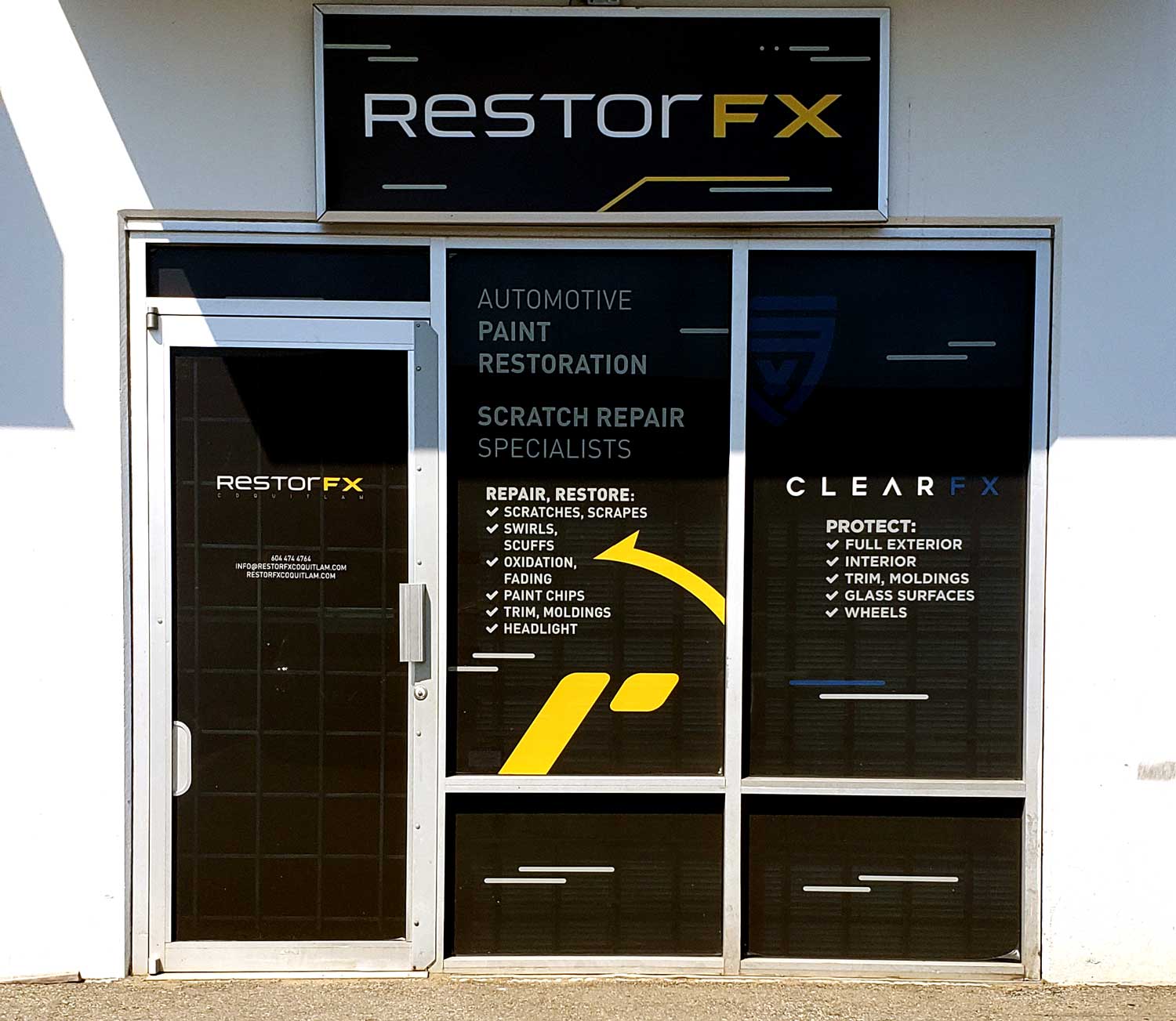 RestorFX Coquitlam storefront with branded window signage and facade on white walls