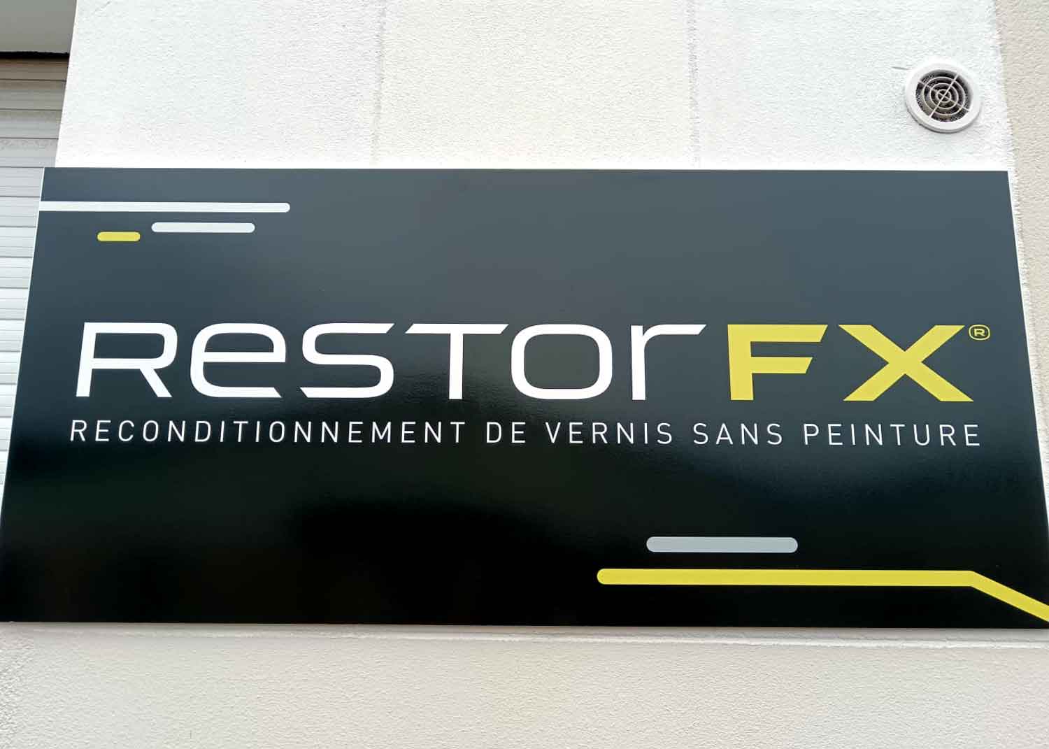 RestorFX La Rochelle sign mounted on the exterior wall