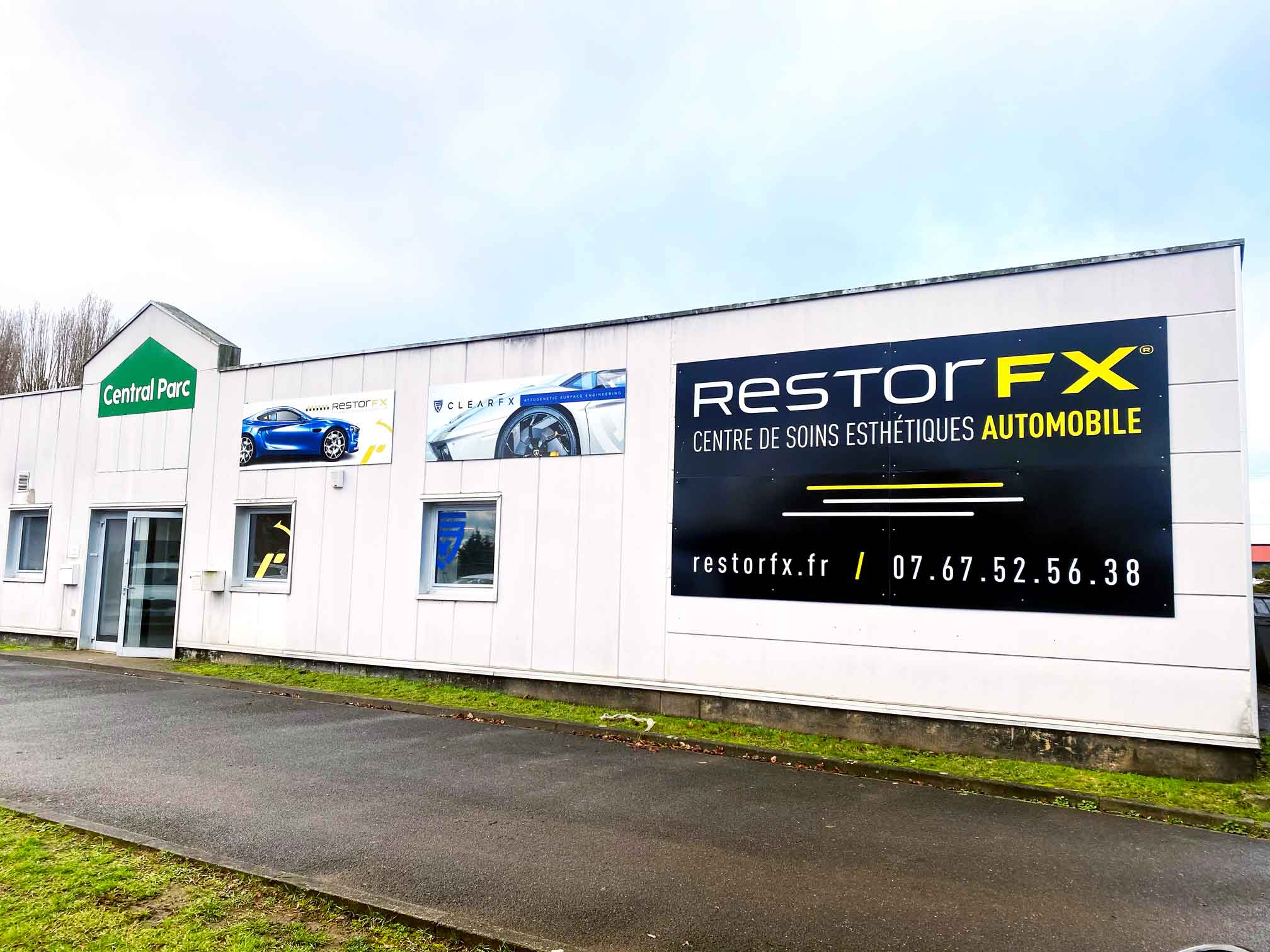 RestorFX Lille storefront on cloudy day with branded signage and windows on light background