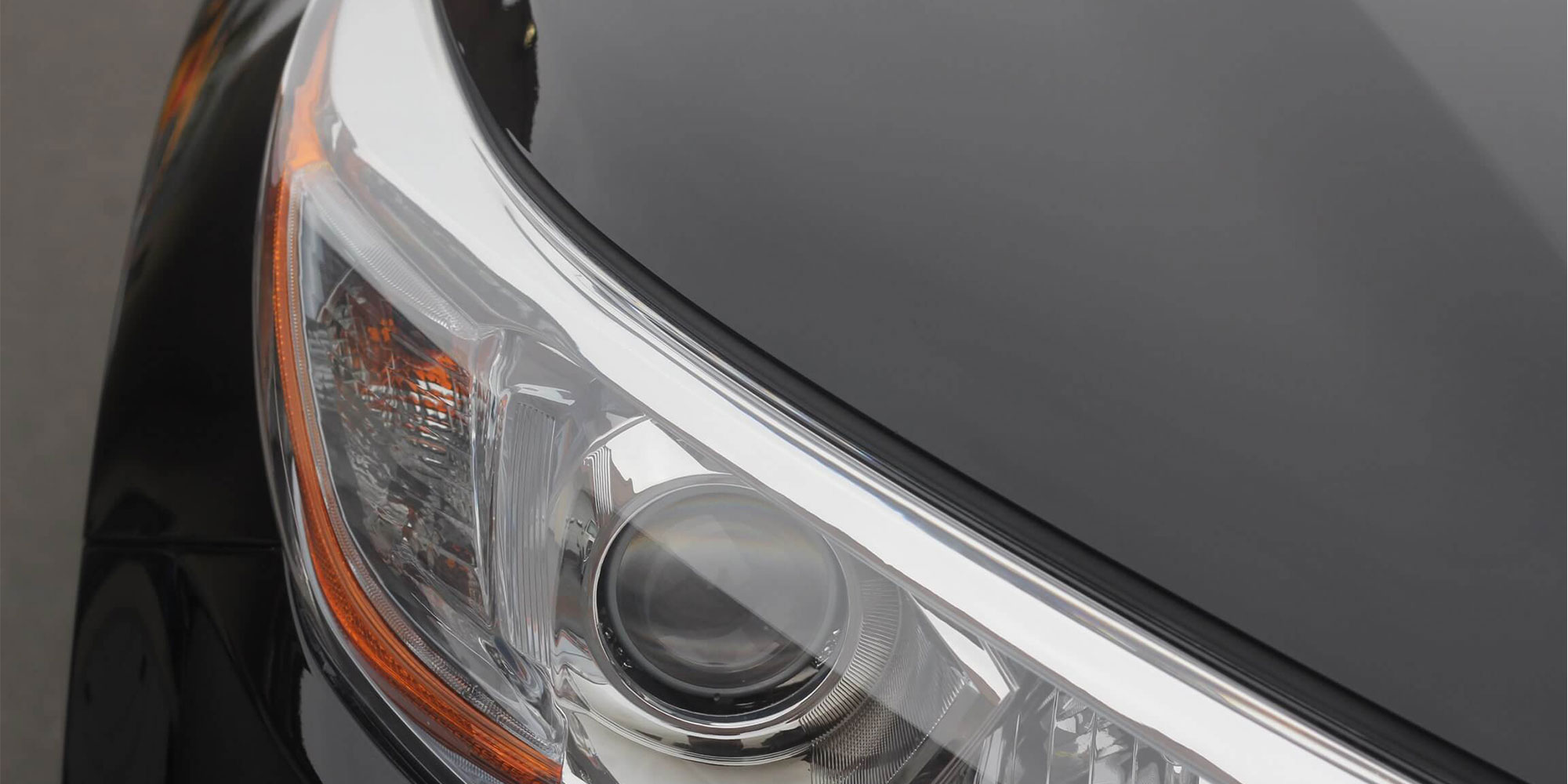 Clear and shiny headlight of a black car